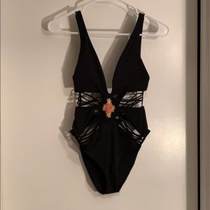 Women’s cut out black one piece.